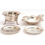 Mixed Lot: Edward VII silver bowl of squat circular form with card cut wavy rim standing on three