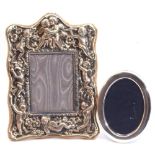Mixed Lot: an ornate EPNS photograph frame, heavily embossed with cherubs and flowers, easel back,