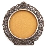 White metal photograph frame of circular form, a foliate pierced design stamped verso 800 and H.
