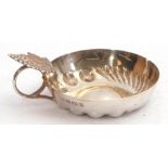 Elizabeth II silver wine taster, the circular bowl with traditional beading and fluting, the ring