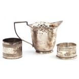 Mixed Lot: Edward VII silver cream jug, helmet shaped with pierced design, reeded angular handle