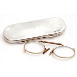 George V silver spectacle case with full length hinge, opening to a velvet lined interior containing