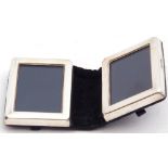 Modern white metal folding small double photograph frame in a blue velvet case, 7 x 5cm, London,