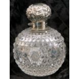 Late Victorian cut glass and silver mounted scent bottle, the hinged cover embossed with scrolls, to