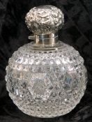 Late Victorian cut glass and silver mounted scent bottle, the hinged cover embossed with scrolls, to