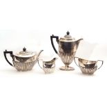 Late Victorian silver tea and coffee service comprising a coffee pot and tea pot, both with ebonised