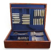 Part oak-cased canteen, matched with Old English pattern silver flatware, comprising eight table