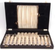 Part cased silver handled fish set for six people, having engraved blades and silver filled Kings