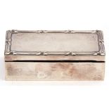 Antique hallmarked silver mounted ebony trinket box of plain polished rectangular form, the lid with