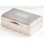 George VI silver table cigarette casket, engine turned decoration with a rectangular vacant