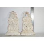 TWO WHITE PLASTER MOULDINGS