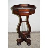 UNUSUAL MAHOGANY OCTAGONAL TABLE RAISED ON FOUR TURNED FEET WITH A LYRE SHAPED SUPPORT BELOW A
