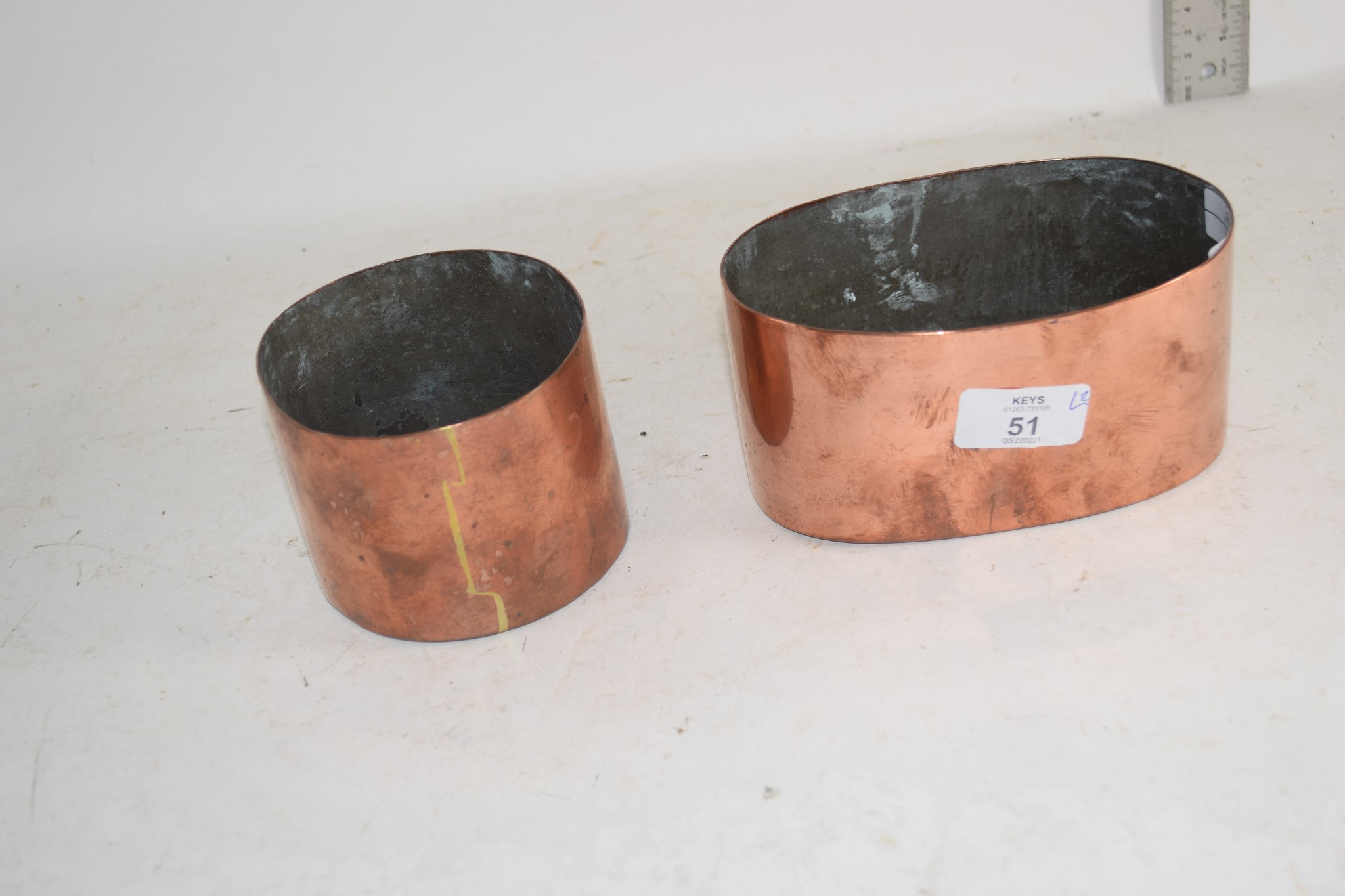 TWO COPPER CYLINDRICAL HOLDERS AND OVAL DISH