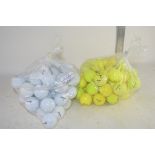 TWO BAGS OF GOLF BALLS