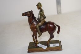 METAL FIGURE OF A POLO PLAYER ON RECTANGULAR METAL BASE