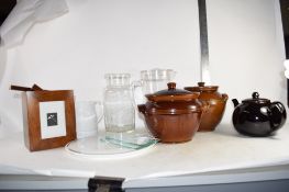 TRAY CONTAINING KITCHEN WARES INCLUDING TWO BROWN GLAZED POTS AND COVERS AND A TEA POT AND OTHER