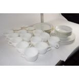 BOX CONTAINING WHITE GLAZED CHINA CUPS AND SAUCERS WITH SIDE PLATES