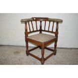 JOINTED OAK CORNER ARMCHAIR WITH UPHOLSTERED ARMS AND CARVED DECORATION TO BACK, TOTAL WIDTH