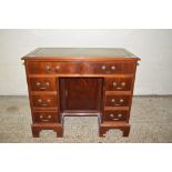 REPRODUCTION SMALL MAHOGANY TWIN PEDESTAL DESK WITH GILT GREEN TOOLED LEATHER INSERT, TWO FRIEZE