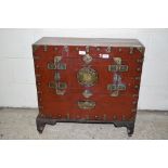 ORIENTAL RED STAINED AND BRASS MOUNTED CHEST, TWO SMALL DOORS TO FRONT ENCLOSING A VOID INTERIOR