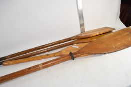 FOUR WOODEN PADDLES