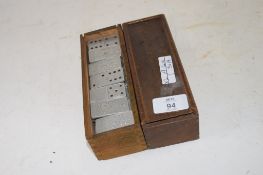 BOX CONTAINING DOMINOES