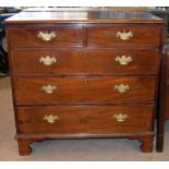 George III period mahogany chest of two and three drawers with engraved brass fittings, shaped