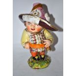 Late 18th century Derby Mansion House dwarf, the base incised No 227, the figure with large hat with