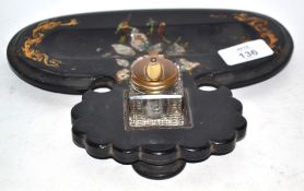 Glass inkwell inset into a lacquer and mother of pearl tray