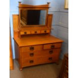 Early 20th century Art Nouveau oak wardrobe having a spreading balustraded pediment over a single