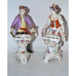 Pair of Continental porcelain Berlin style sweetmeat figures of gentleman and lady, decorated with