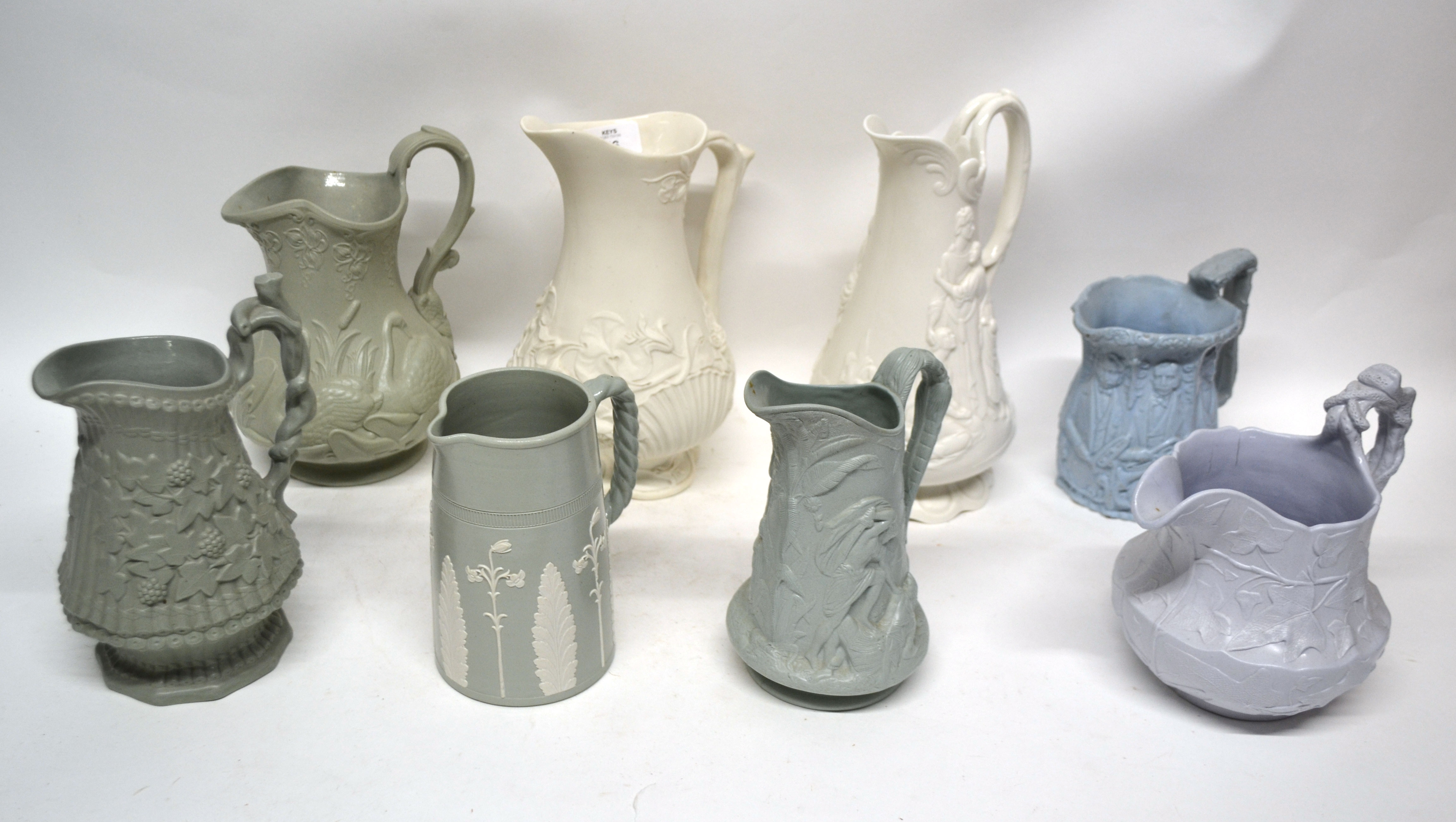 Group of 19th century pottery relief decorated jugs including Naomi and her daughters-in-law, one