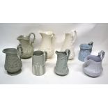 Group of 19th century pottery relief decorated jugs including Naomi and her daughters-in-law, one