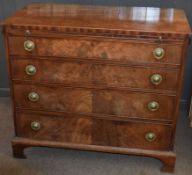 Late Georgian mahogany chest of four graduated drawers with circular embossed brass ring handles