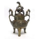 Oriental brass Koro and cover with dragon finial, height 26cm