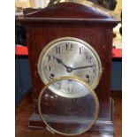 Mahogany cased mantel clock with German movement, circular Arabic chapter ring and bracket feet,