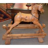 Good quality carved pine rocking horse with stretcher base, width 133cm x 57cm deep x 110cm high (