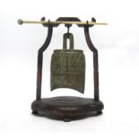 Oriental model of a temple bell in wooden mount
