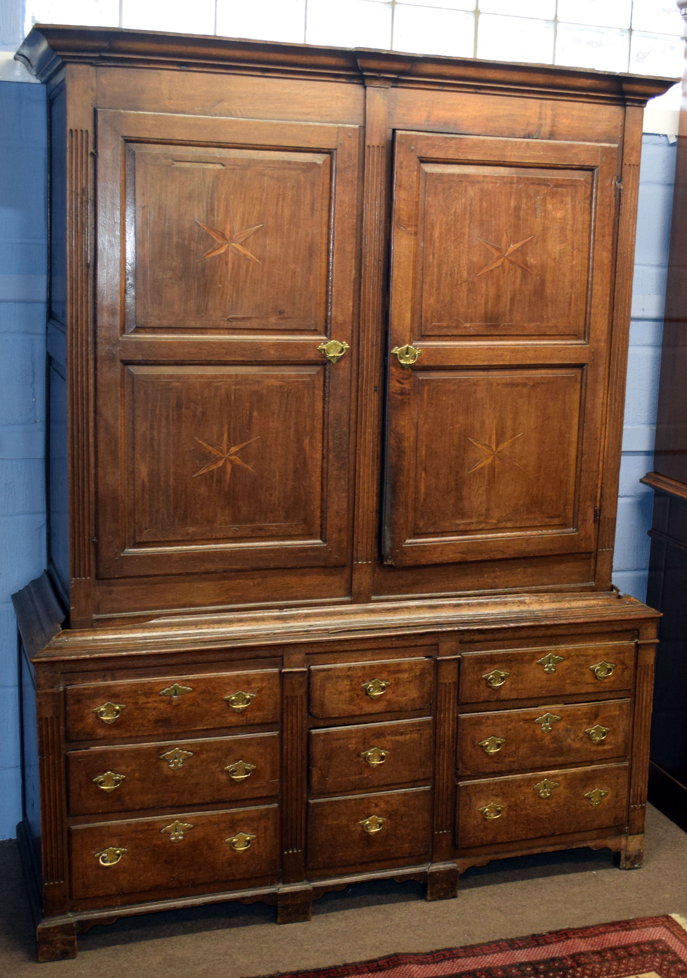 18th century oak housekeeper's cupboard, moulded corners over two double panelled doors and the base