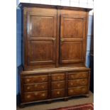 18th century oak housekeeper's cupboard, moulded corners over two double panelled doors and the base