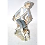 Lladro figure of a young boy with hound by his feet