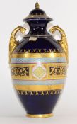 Late 19th century Vienna style porcelain vase and cover, the blue ground with gilt bordered oval