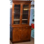 Late 19th century mahogany bookcase cabinet, the top with two plain glazed doors beneath a dentil