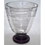 Art Deco glass vase of flared form on stepped purple base, decorated with stylised leaves in relief,