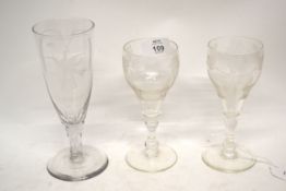 Pair of 18th century style wine glasses, finely engraved with fruiting vines above a double