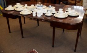 19th century mahogany D-end dining table, the two ends joined by two central leaves with brass clips