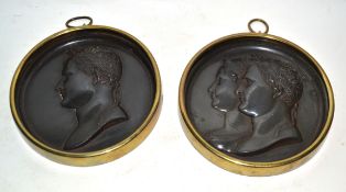 Two metal plaques with heads of Roman emperors