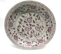 Large oriental porcelain charger decorated in copper red with a Ming style floral design, 40cm diam