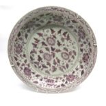 Large oriental porcelain charger decorated in copper red with a Ming style floral design, 40cm diam
