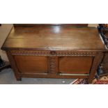 18th century oak coffer with staple fixed two-part top, wavy carved frieze and uprights, two plain